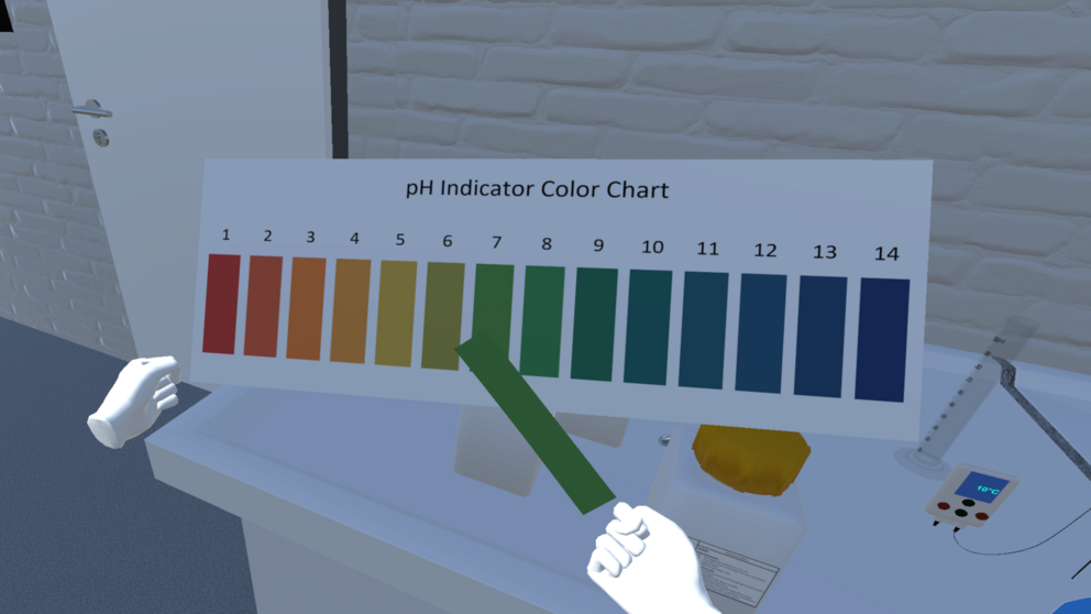 A student compares the color of a pH indicator paper with a color scale inside of the VirtuChemLab