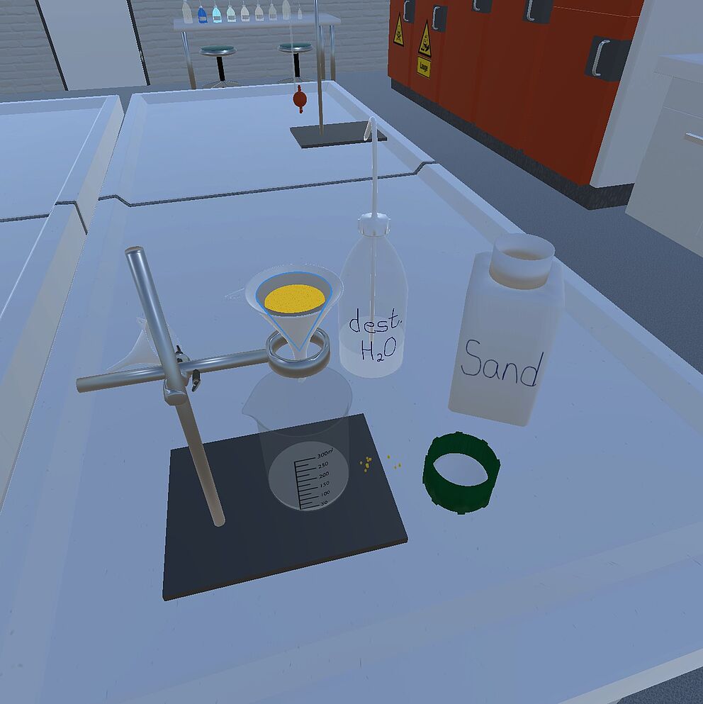 Water flows through a filter filled with sand in the VirtuChemLab.