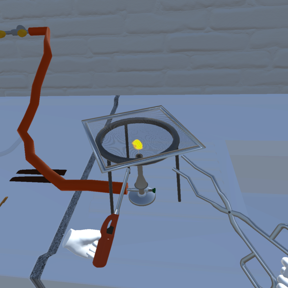 The student ignites a gas burner in the VirtuChemLab.